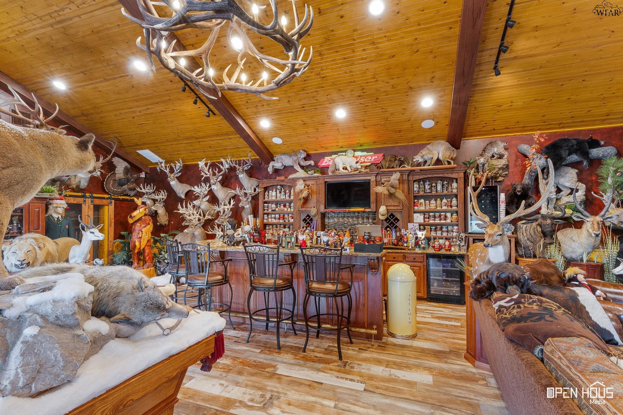 Pool house great room with stone fireplace