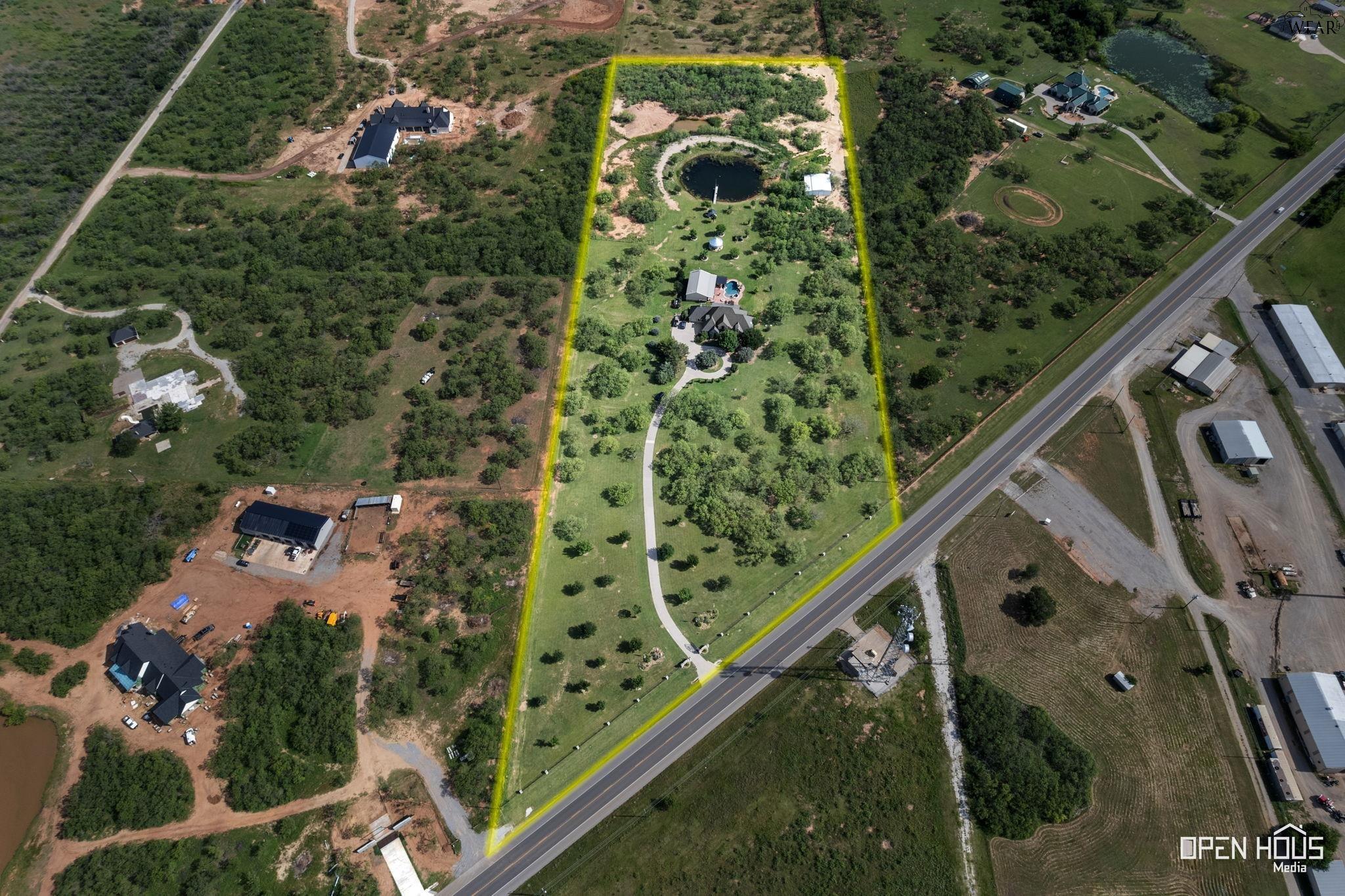 Aerial view showing property boundaries across 12.72 acres